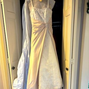 Ivory/blush wedding gown. Beautiful beading.Professionally cleaned.